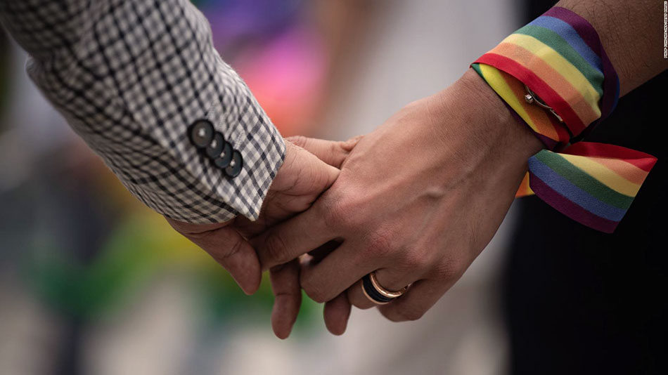 191018120925 a same sex couple hold hands during an event to raise awareness of gay rights in hong kong full 169
